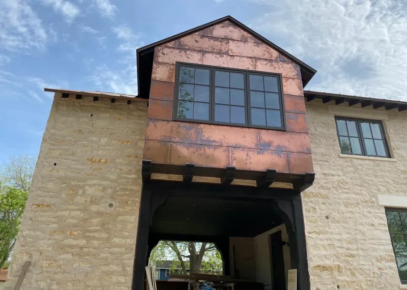 Copper metal panel facade on a stone building for Metal Roof Coating in Valley