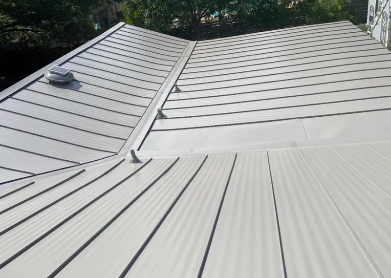 Solar attic fan installed on a metal roof for Roof Ventilation in Valley